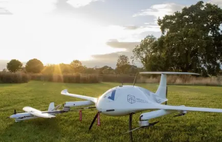 A large medical drone standing on a green glade